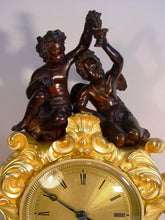 Load image into Gallery viewer, A French Early 19th Cent Gilt Bronze Rococo Mantel Clock With Cherubs
