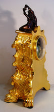 Load image into Gallery viewer, A French Early 19th Cent Gilt Bronze Rococo Mantel Clock With Cherubs
