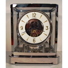Load image into Gallery viewer, A Rhodium Plated 1953 Jaeger Bell-Jar Model Swiss Atmos Clock With A White Dial