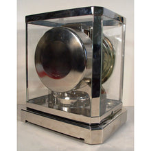Load image into Gallery viewer, A Rhodium Plated 1953 Jaeger Bell-Jar Model Swiss Atmos Clock With A White Dial
