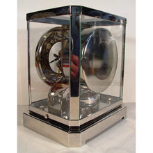 Load image into Gallery viewer, A Rhodium Plated 1953 Jaeger Bell-Jar Model Swiss Atmos Clock With A White Dial