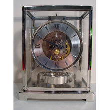 Load image into Gallery viewer, A 1950's Rhodium Plated Jaeger Classic Model Swiss Atmos Clock With Roman Numerals And Box