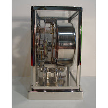 Load image into Gallery viewer, A 1950's Rhodium Plated Jaeger Classic Model Swiss Atmos Clock With Roman Numerals And Box