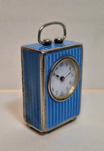 Load image into Gallery viewer, A silver and blue enamel eight day Swiss clock.
