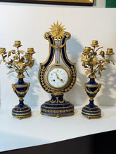 Load image into Gallery viewer, A French Three Piece Porcelain Lyre Clock Set.