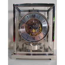 Load image into Gallery viewer, A 1950&#39;s Rhodium Plated Jaeger Classic Model Swiss Atmos Clock With Roman Numerals And Box